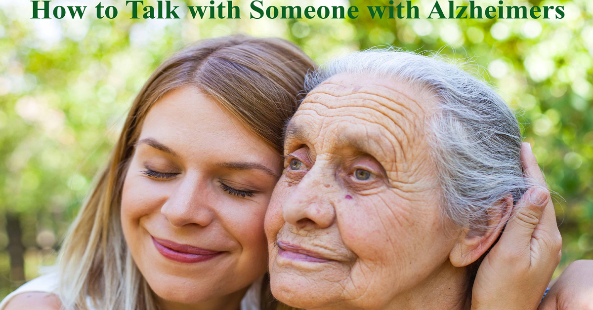 How to Talk with Someone with Alzheimers. Picture of a young caucasian woman hugging a caucasian elderly woman.